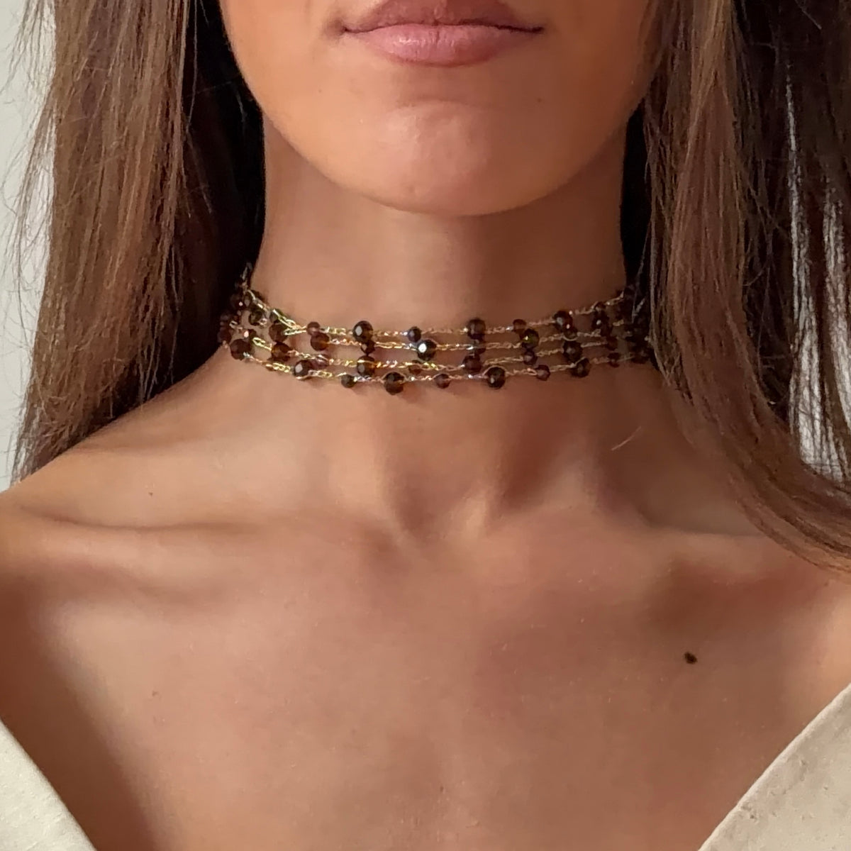 Collier à pompons marron 
